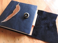 Leaf motif leather covered book